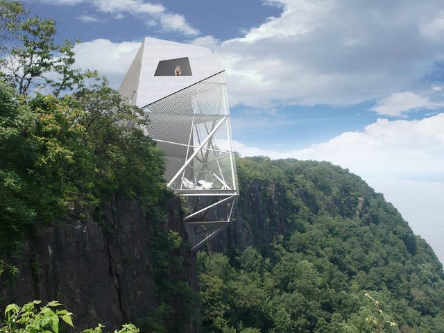 Photo of the house on the cliff with vegetation and the park behind