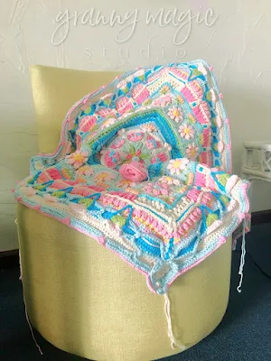 Crochet project draped on chair.