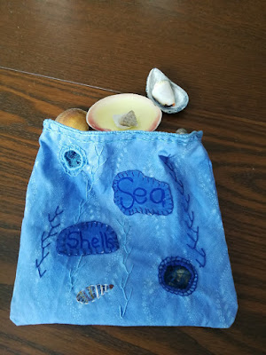 Embroidered sea shell container