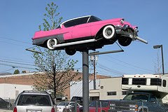 pink cadilac on pole