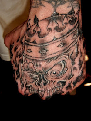 skull tattoo arm. skull tattoo on left arm