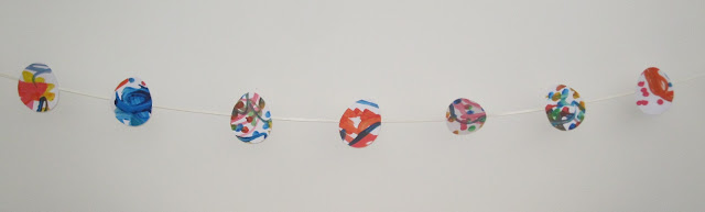 Bunting with egg shapes hanging from it