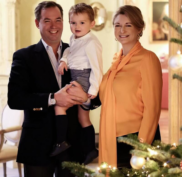 Princess Stephanie wore an orange pussy-bow crepe de chine blouse by Paule Ka. Prince Guillaume and Prince Charles