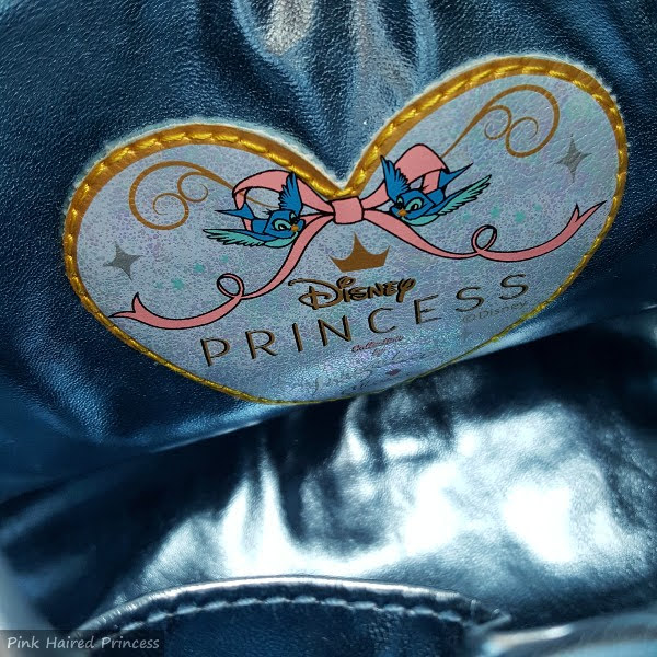 blue metallic lining inside handbag with Disney Irregular Choice branding