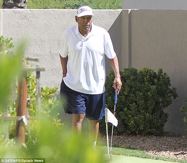 OJ Simpson pictured playing golf with his daughter at his Las Vegas home 