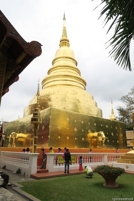 large impressive golden chedi, with golden elephants emerging from all four sides