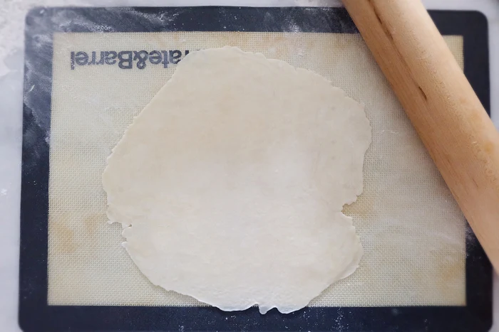 dough segment rolled flat into a circle