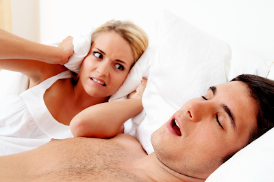 A guy snoring while his girlfriend is trying to sleep