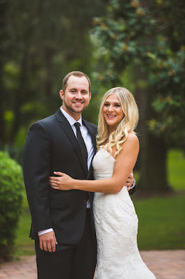 bride and groom smiling for photo