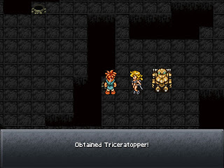 The group navigates a darkened room full of warp points in the Tranno Lair, a dungeon in Chrono Trigger.