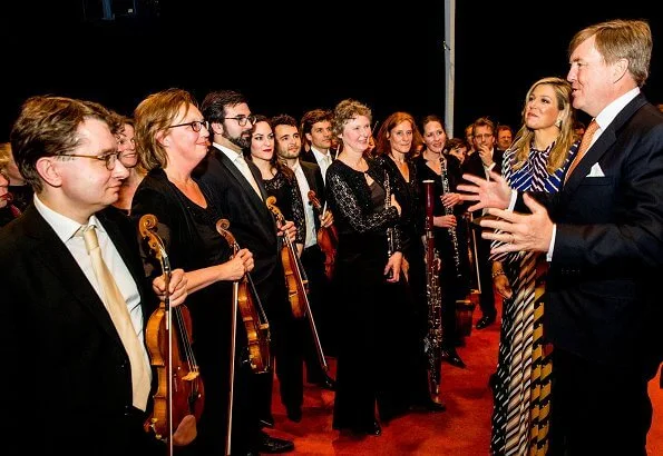 Queen Maxima wore Mary Katrantzou Duritz pussy bow printed crepe de chine maxi dress Natan pumps and clutch. Princess Beatrix style fashions