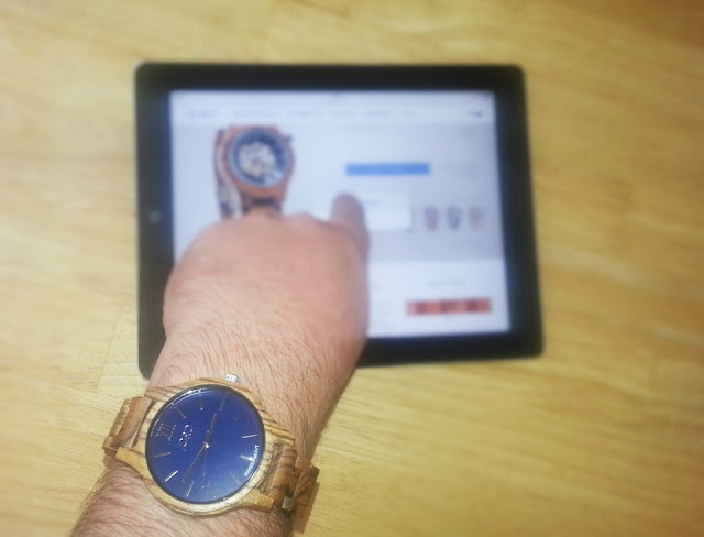Jord watch on man's wrist using ipad