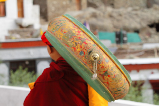 Monk carrying traditional music instrument at Hemis Monastery, Ladakh