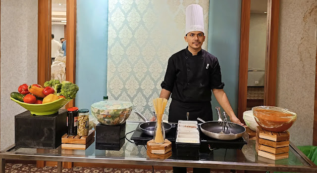 Commi chef working in live cooking
