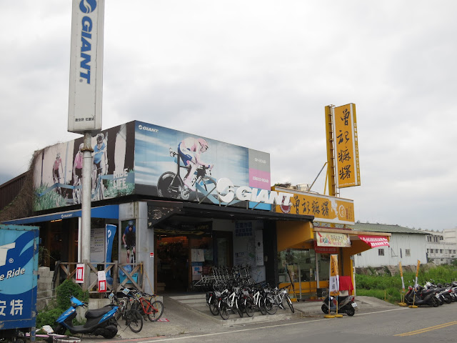 Giant bicycle rental shop, located near the train station and orange ...