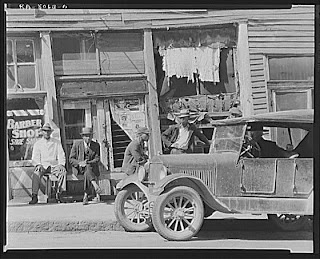 Car in Front of a Barbbershop