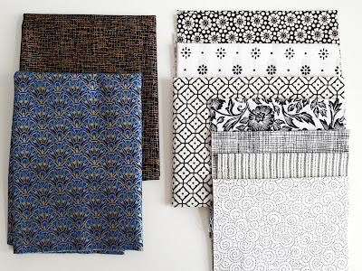 Selection of pieces of quilting fabric with small-scale prints