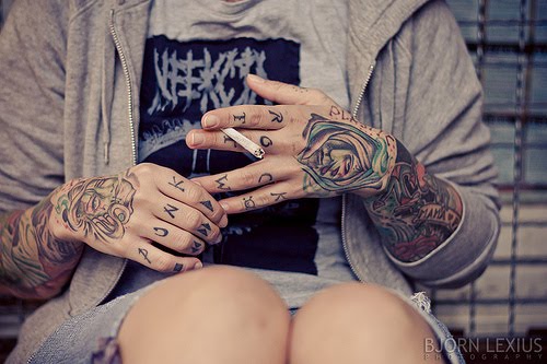 tattoos on hands and fingers. the tattoos on the first picture are mixed up a littlepart whack, 