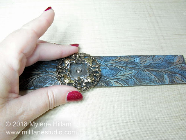 Centering the filigree on the leather strip