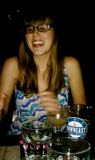 Awkwardly laughing at the flash in the dimly lit bar