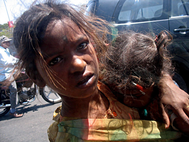 begging girl with baby