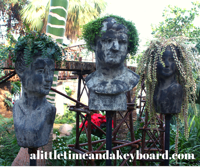 Sculptures with funky plant hairdos at Nicholas Conservatory in Rockford, Illinois