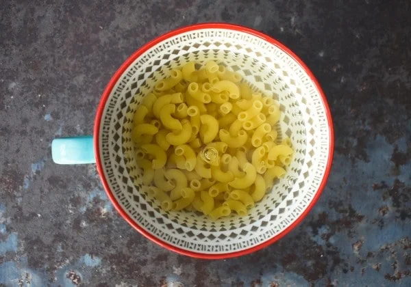 Pasta and water in mug