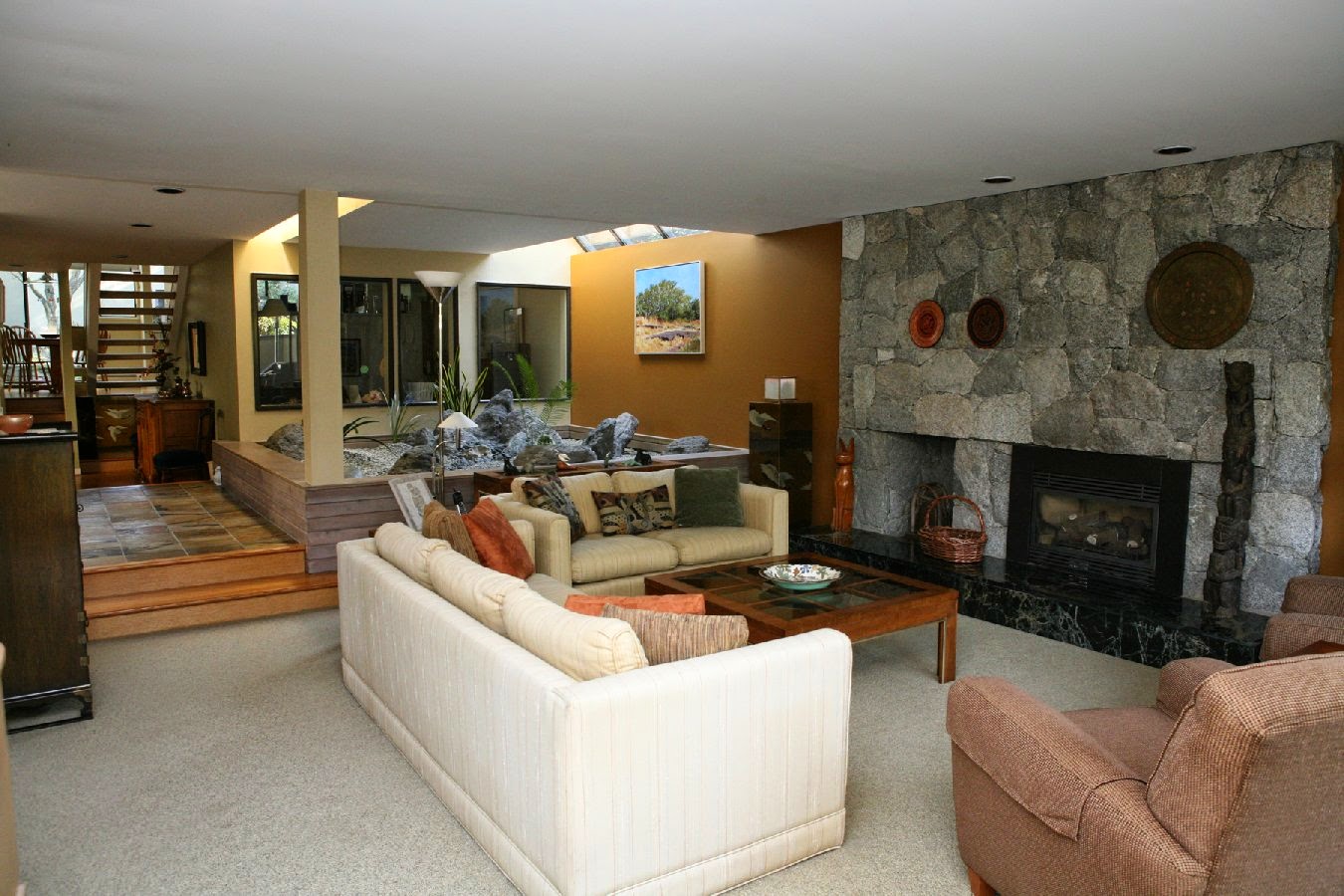 living room with fireplace and tv on opposite walls