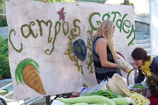 Students sell food at one of the last farmer's markets of the season