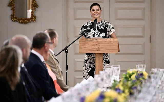 Crown Princess Victoria wore a new Slouch waist floral dress by Toteme. Lara Bohinc saturn earrings
