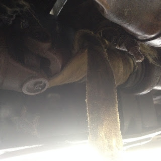 Strap wrapped up in drive shaft broken exhaust and fuel tank