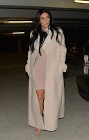 Kim Kardashian flaunts pregnancy curves in a pink mini dress in London