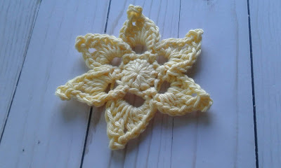star shaped crochet flower in yellow