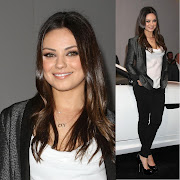 The actress wore a cowlfront white top with black skinny jeans, .