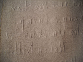 The back of the note, through which the impressions of the letters are strongly pressed.