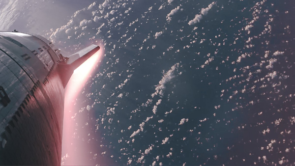 A plasma field begins forming underneath Starship as it re-enters Earth's atmosphere in an attempt to complete Integrated Flight Test 3...on March 14, 2024.