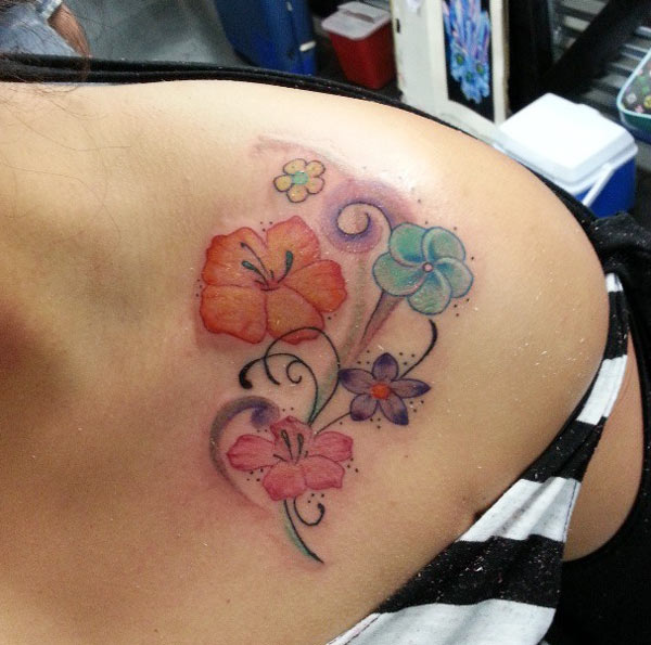 beautiful small colorful flower tattoo designs give a trendy look on the female