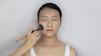 Modern Oriental Bridal Makeup - Tap the loose powder with powder brush and sweep gently to set the make up