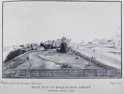Drawing of a fenced rectangle of cleared land with a farmhouse on the far end. On the left is a cliff down to the Ottawa River. On the right is a dirt road running alongside the property, with some pedestrians drawn in, including a mother and small child. Across this road is another farm property with fenced yard, and beyond that yard are faint outlines of buildings that presumably were on Wellington Street. 