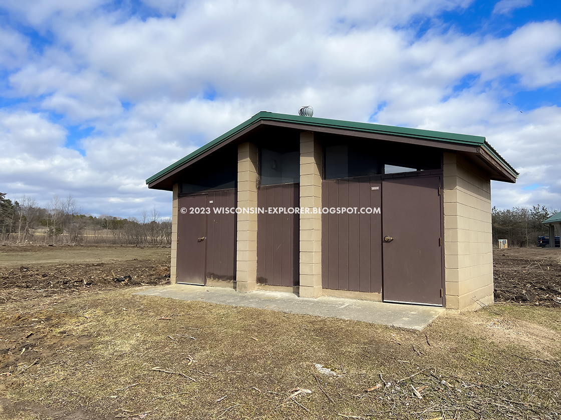 older restroom building amid construction site