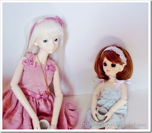 Naming the new doll over some tea.