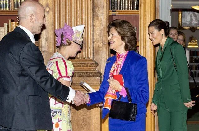Princess Sofia wore a new guthern burnout floral gold midi dress by French Connection. Crown Princess Victoria wore a green suit