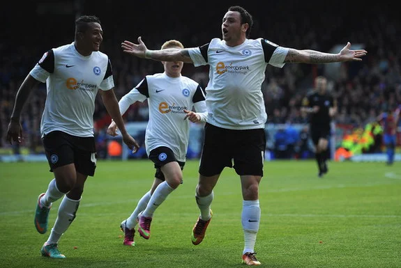 Peterborough player Lee Tomlin celebrates after scoring a goal against Crystal Palace