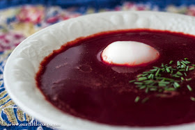 borsht, borsh, or borscht served with egg and garnished with chives