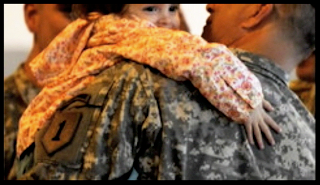 Picture of Army soldier holding infant