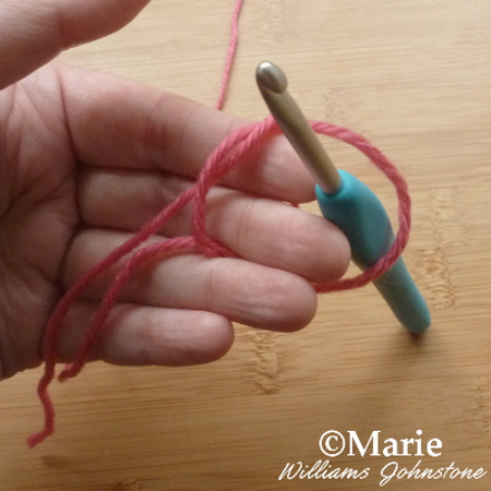 Tying and making a slip knot on the fingers to start off crochet