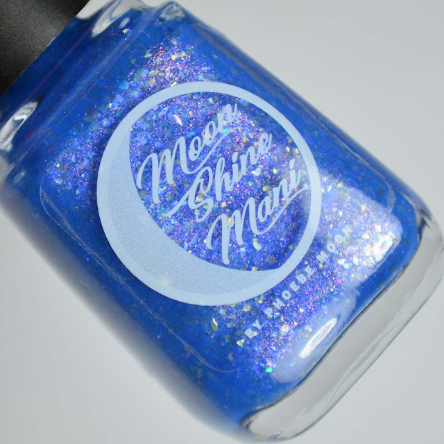 blue nail polish with flakies and shimmer