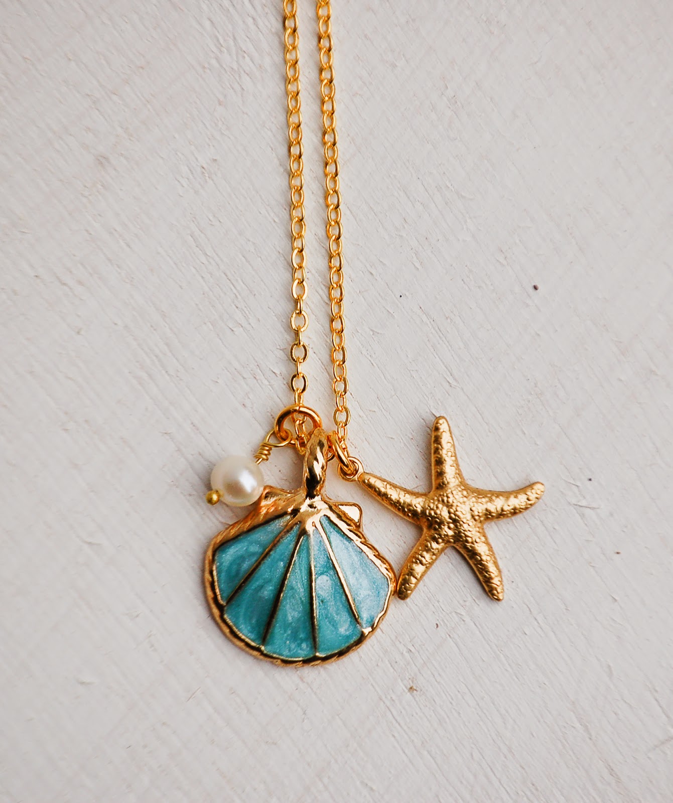 https://www.etsy.com/listing/223991572/sea-shell-necklace-gold-shell-necklace?ref=shop_home_active_1&ga_search_query=shell
