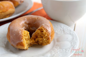 Moist cake donuts are packed with pumpkin and then drizzled in a cinnamon glaze in these delicious Cinnamon Glazed Pumpkin Buttermilk Donuts.