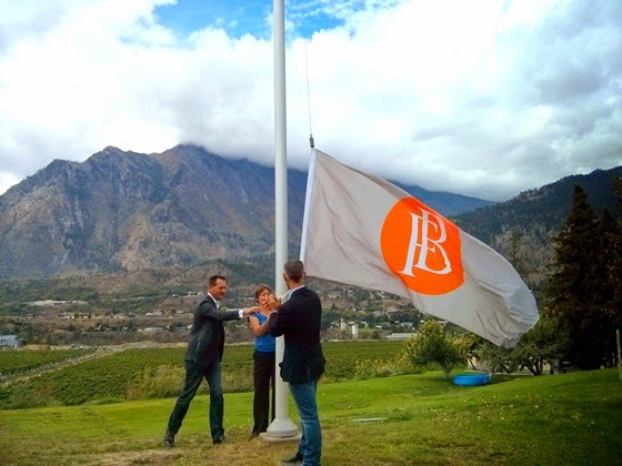 Rolf, Heleen, and Hugh prepare to raise the flag